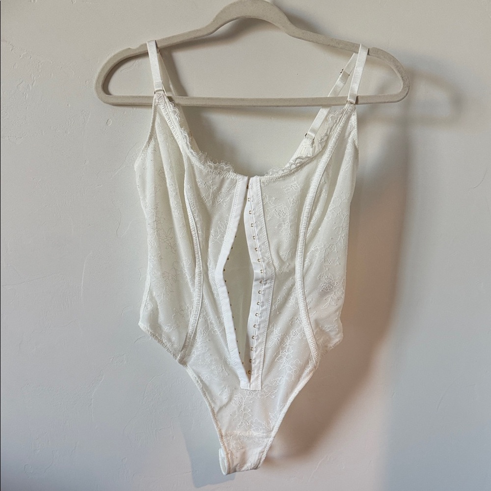 Never worn bodysuit White Lace Hook-Front With Adjustable Straps